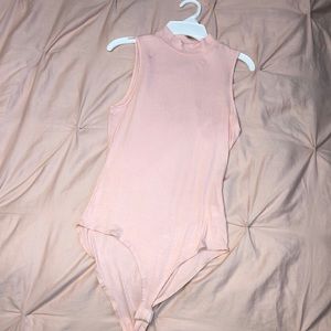 Baby pink body suit